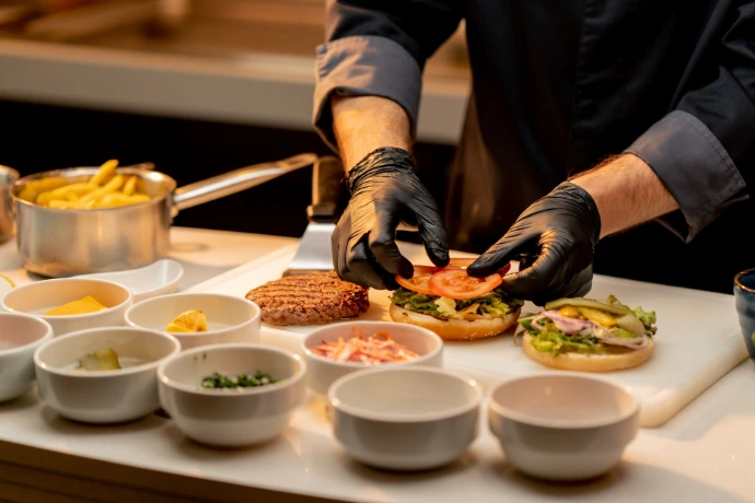 Chef plating dishes during live event catering service